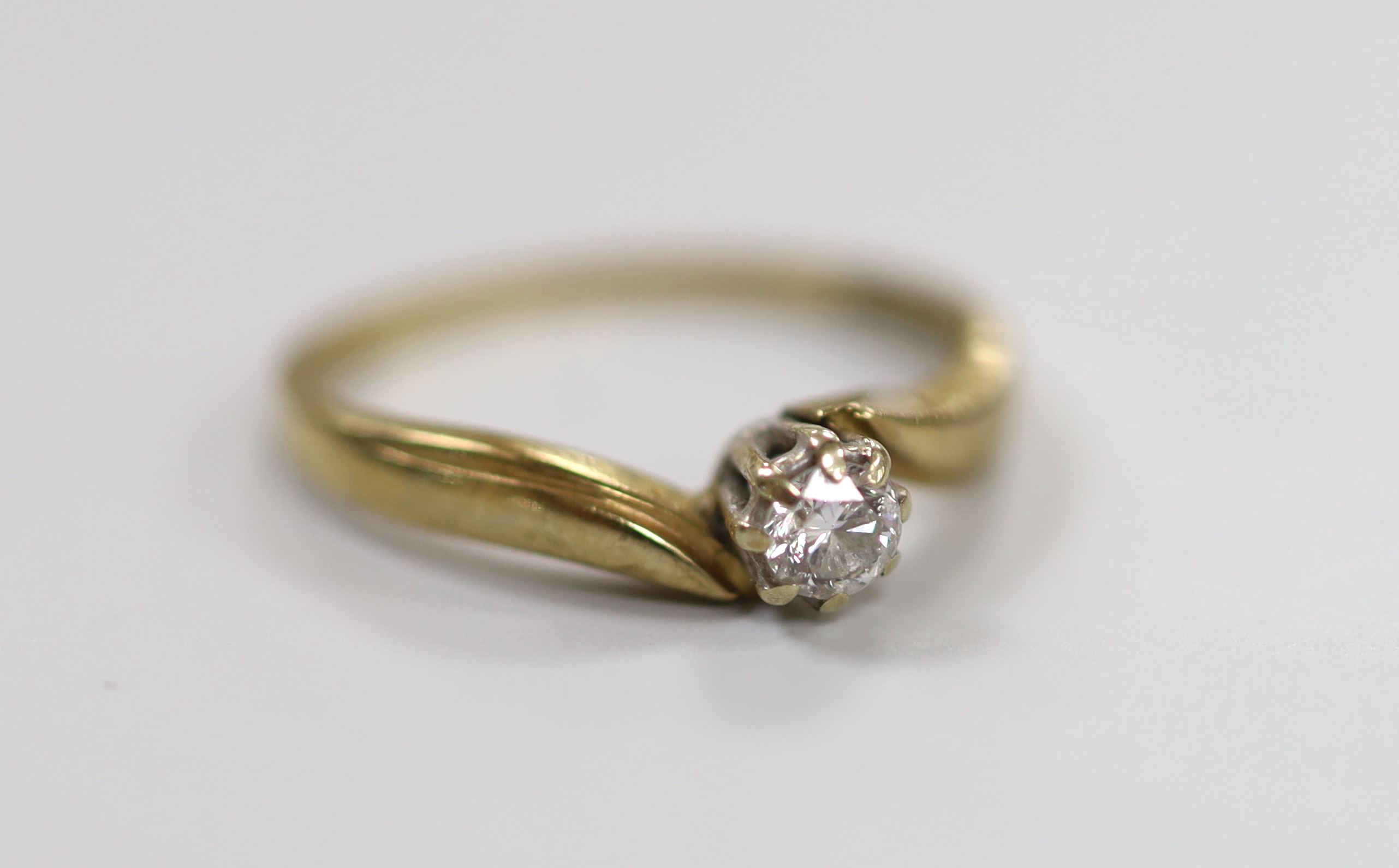 A modern 9ct gold and solitaire diamond ring, size M, gross weight 1.9 grams.